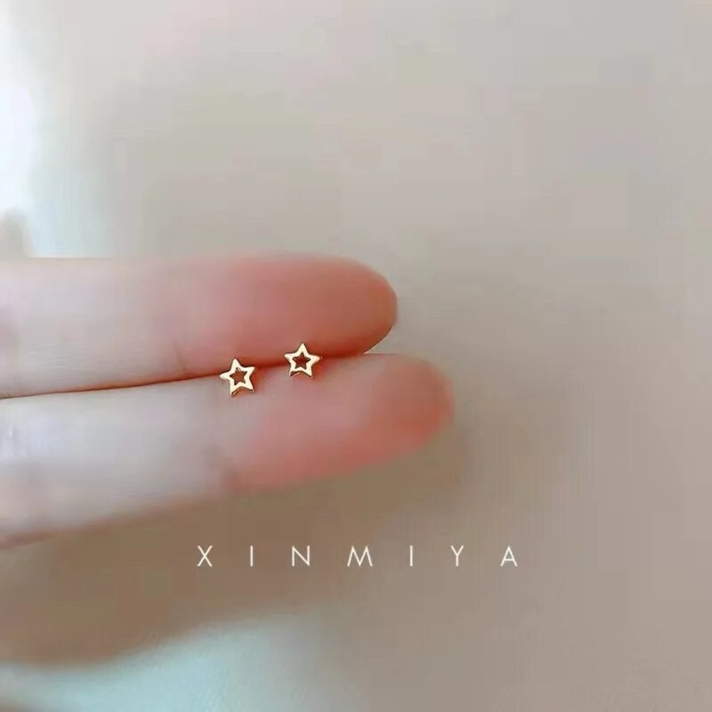 Gold plated minimalist star earrings.